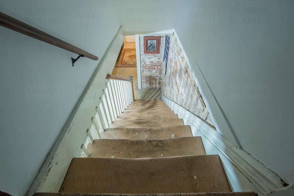 A photo of the basement stairs of Octagon hall, without a looming shadow person
